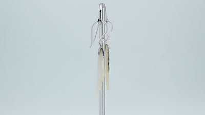 Sterling silver mother of pearl leaf drop earrings with layered shell and polished finish