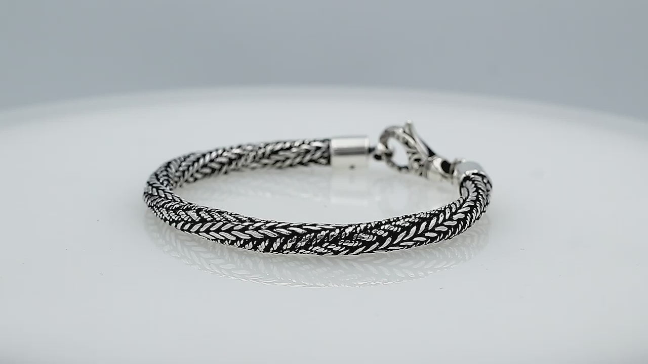 Wholesale sterling silver bracelet featuring a 5MM handwoven Balinese chain design with oxidized detailing and a decorative lobster lock for secure fastening and durability.