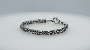 Wholesale sterling silver bracelet featuring a 5MM handwoven Balinese chain design with oxidized detailing and a decorative lobster lock for secure fastening and durability.