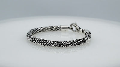 Wholesale sterling silver bracelet featuring a 5MM handwoven Balinese chain design with oxidized detailing and a decorative lobster lock for secure fastening and durability.