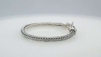 Wholesale sterling silver 5MM woven Bali chain bracelet featuring a decorative lobster lock and polished–oxidized detailing, crafted for premium bulk jewelry inventory requirements.