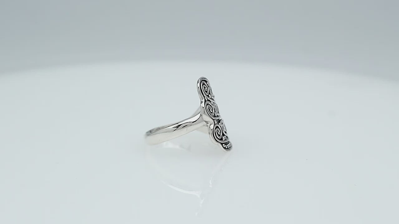 Wholesale sterling silver adjustable ring with dual Balinese swirl and dot panels, handcrafted in Bali, artisan bulk jewelry design.