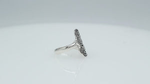 Wholesale sterling silver adjustable ring with dual Balinese swirl and dot panels, handcrafted in Bali, artisan bulk jewelry design.