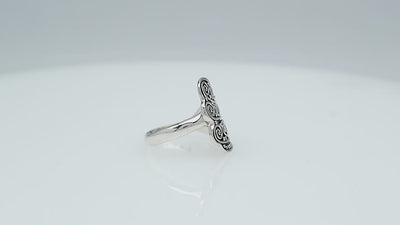 Wholesale sterling silver adjustable ring with dual Balinese swirl and dot panels, handcrafted in Bali, artisan bulk jewelry design.
