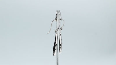 Wholesale sterling silver teardrop earrings with vibrant abalone shell inlay and Balinese scroll detailing, handcrafted in Bali