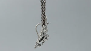 Wholesale sterling silver dragon head pendant with intricate carving, handcrafted Bali artisan jewelry for bulk buyers.