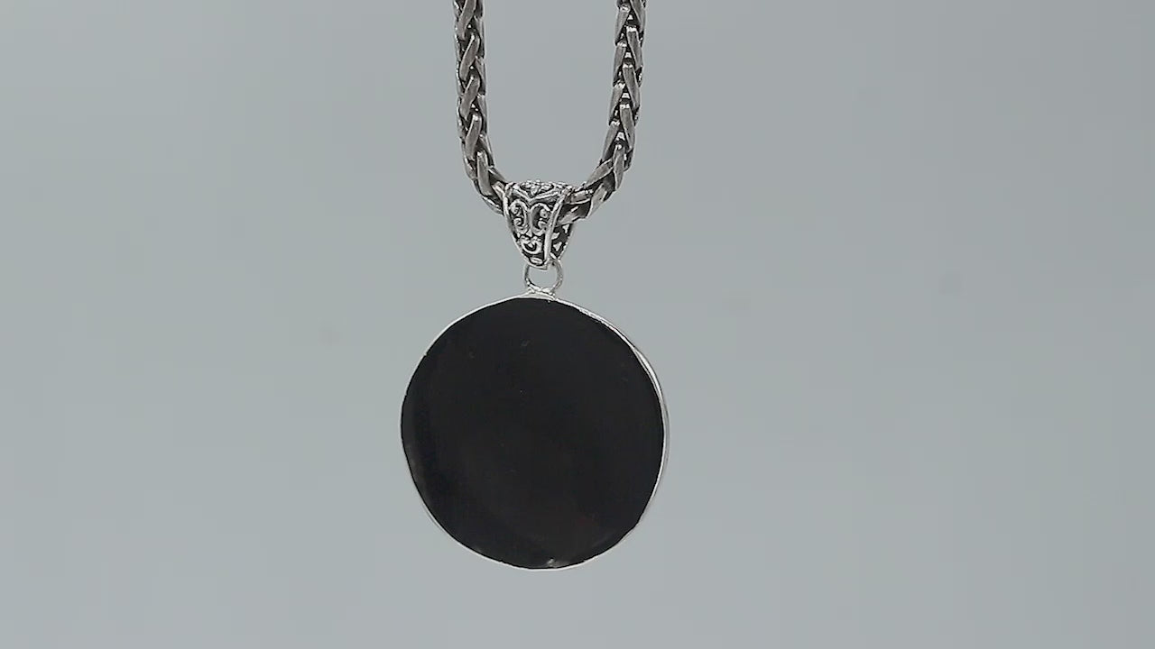 Wholesale sterling silver round pendant with abalone shell inlay and floral scroll accents, handcrafted Bali artisan jewelry for bulk buyers.