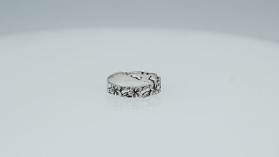 Wholesale sterling silver plumeria flower band ring with leaf motif, handcrafted Bali artisan jewelry for bulk orders and resellers.