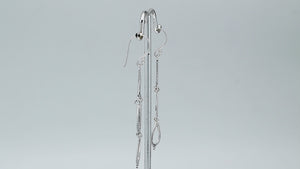 Sterling silver chandelier drop earrings featuring four open teardrop frames, twisted rope borders, small bead accents, articulated tiered construction, and elongated ear wires.