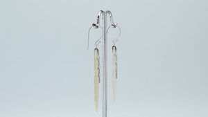 Sterling silver mother of pearl carved leaf drop earrings with polished silver detailing and handcrafted shell design.