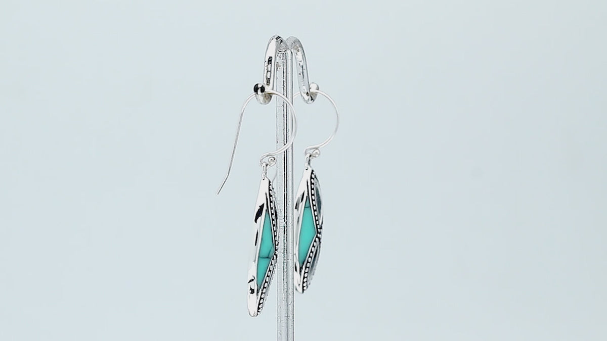 925 Sterling Silver Turquoise Shell marquise drop earrings featuring bright turquoise blue inlays, infinity-inspired double openwork motifs, oxidized dotted silver detailing, polished borders, and elegant fishhook ear wires.