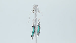 925 Sterling Silver Turquoise Shell marquise drop earrings featuring bright turquoise blue inlays, infinity-inspired double openwork motifs, oxidized dotted silver detailing, polished borders, and elegant fishhook ear wires.