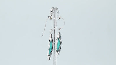 925 Sterling Silver Turquoise Shell marquise drop earrings featuring bright turquoise blue inlays, infinity-inspired double openwork motifs, oxidized dotted silver detailing, polished borders, and elegant fishhook ear wires.