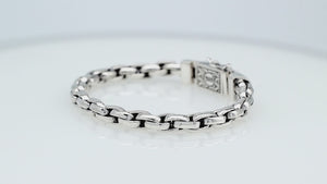 Sterling silver round braided link chain bracelet featuring substantial interwoven links, polished surfaces, oxidized accents, and an engraved decorative box clasp.
