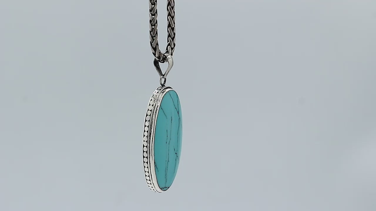 925 sterling silver oval pendant with turquoise shell and hammered silver edge handcrafted in Bali