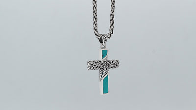 Sterling silver ornate cross pendant with turquoise shell inlay and oxidized scroll detailing