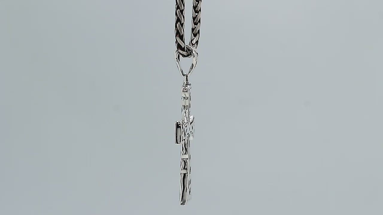 Wholesale sterling silver hammered cross pendant with raised texture.