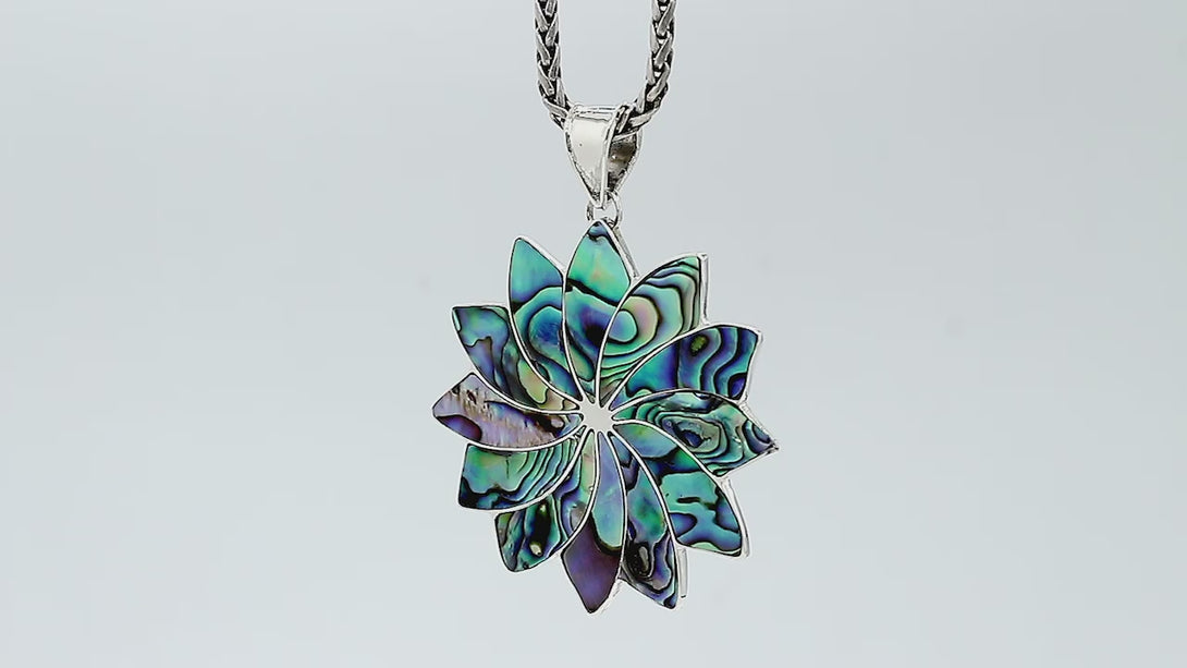 Sterling silver flower pendant with genuine Abalone Shell, handcrafted in Bali with multi-petal design – wholesale gemstone jewelry supplier.