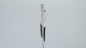 Wholesale sterling silver earrings featuring Black Shell ovals with an ornate patterned silver cap.