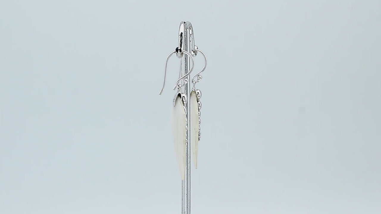 Sterling silver mother of pearl carved leaf drop earrings with polished silver bead detailing and handcrafted shell design.