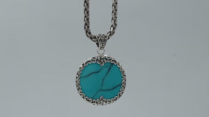 Sterling silver round pendant with genuine turquoise, handcrafted in Bali with floral and scroll design – wholesale gemstone jewelry supplier.
