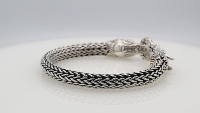 Sterling silver double dragon head bracelet with woven chain and oxidized finish