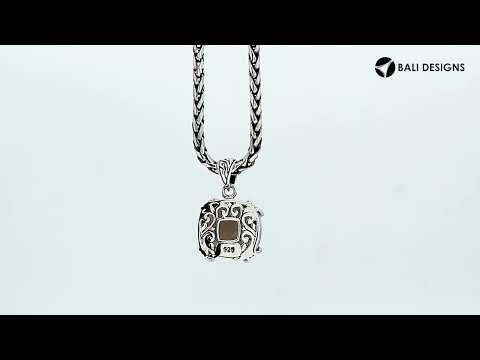 Sterling silver cushion pendant featuring a faceted Smokey Quartz centerpiece secured with decorative prong detailing and traditional Balinese carved ornamentation.