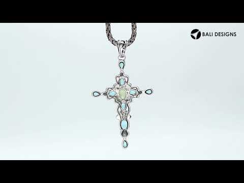 Wholesale sterling silver cross pendant with genuine peridot center stone and blue topaz accents, handcrafted Bali jewelry with ornate detailing for bulk orders.