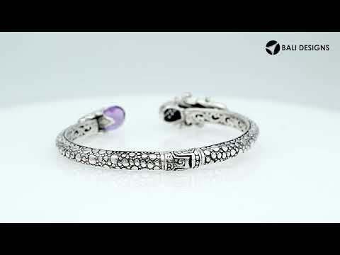 Sterling silver dragon head cuff bangle with black onyx ends and floral carvings handcrafted in Bali.