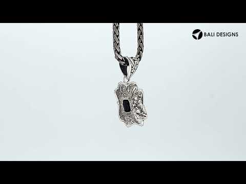 Sterling silver rectangular pendant with Black Onyx center and traditional filigree pattern handcrafted in detailed finish.