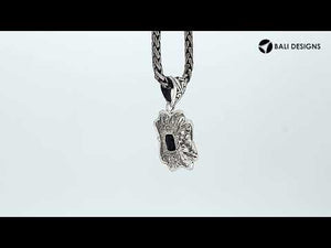 Sterling silver rectangular pendant with Black Onyx center and traditional filigree pattern handcrafted in detailed finish.