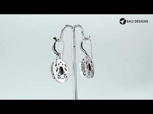 Wholesale sterling silver earrings featuring an oval Mystic Topaz Quartz stone with multicolor brilliance, framed in carved silver detailing and secured with an earwire lock for premium artisan presentation.