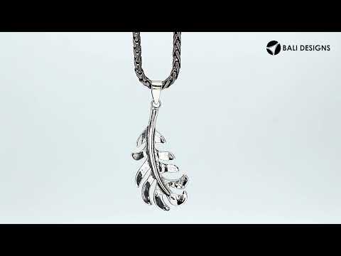 A handcrafted sterling silver feather pendant featuring a flowing leaf design with a mirror-polished finish and smooth texture.