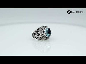 Sterling silver handcrafted Bali ring with round Blue Topaz Quartz and rope scroll design.