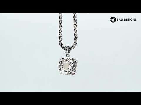 Sterling silver cushion pendant featuring a faceted Morganite Quartz centerpiece secured with artistic prong detailing and traditional Balinese carved embellishments.