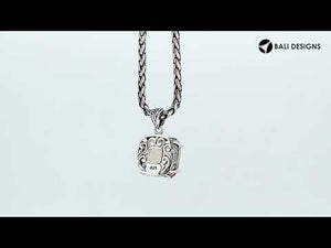 Sterling silver cushion pendant featuring a faceted Morganite Quartz centerpiece secured with artistic prong detailing and traditional Balinese carved embellishments.