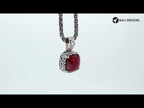Sterling silver cushion pendant featuring Ruby Quartz with Balinese scroll detailing.