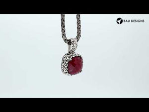 Sterling silver cushion pendant featuring Ruby Quartz with Balinese scroll detailing.