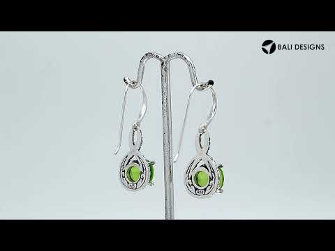Wholesale Sterling Silver Peridot Quartz Round Infinity Earrings With Detailed Balinese-Style Metalwork.