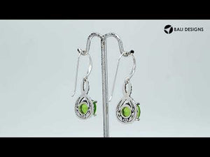 Wholesale Sterling Silver Peridot Quartz Round Infinity Earrings With Detailed Balinese-Style Metalwork.