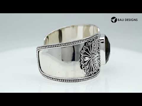 Wholesale sterling silver Bali engraved wide cuff bracelet featuring a bold labradorite centerpiece, enhanced with polished–oxidized detailing for premium bulk jewelry selection.