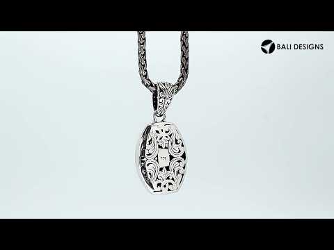 Sterling silver barrel-shaped pendant with Balinese scrollwork, wholesale artisan jewelry.