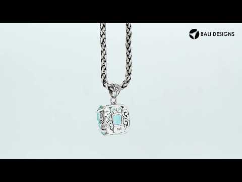 Sterling silver cushion pendant featuring a faceted Blue Topaz Quartz centerpiece secured by artistic prong detailing with traditional Balinese carved accents.