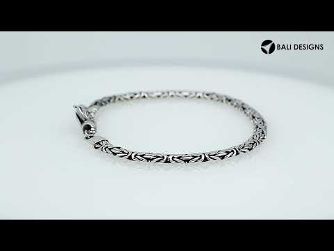 Wholesale sterling silver bracelet featuring a 3MM x 5MM Balinese woven chain with polished and oxidized detailing, finished with a secure lobster lock for catalog presentation.