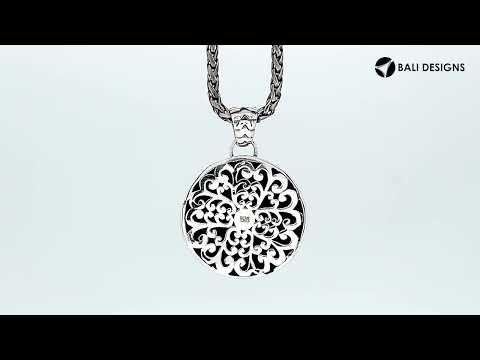 Sterling silver round pendant featuring a hammered texture design with polished edges and classic Balinese detailing suitable for refined catalogue presentation.