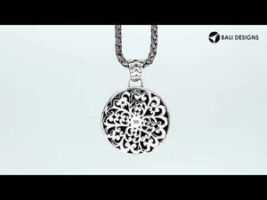 Sterling silver round pendant featuring a hammered texture design with polished edges and classic Balinese detailing suitable for refined catalogue presentation.