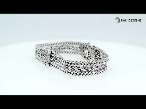 A wholesale sterling silver woven chain bracelet featuring intricate Balinese detailing, oxidized textures, multiple braided strands, and a secure push clasp suitable for bulk jewelry orders.