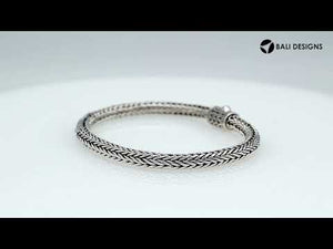 Sterling silver woven bracelet with polished surface and secure push clasp, featuring a classic rounded chain pattern for wholesale supply.