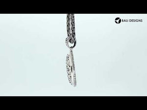 Wholesale sterling silver oval pendant with ornate floral carved design.