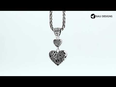 Sterling silver double heart pendant with Black Shell and Balinese detailing in polished finish.